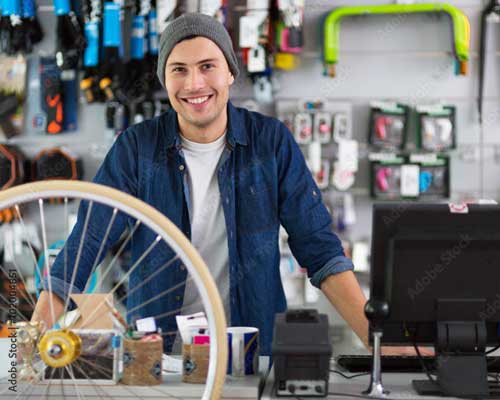 man working at bike rental shop | rental pos