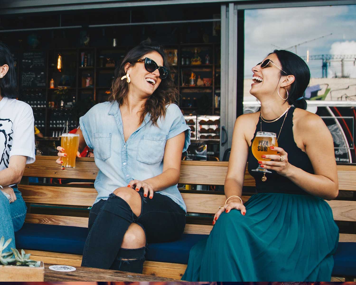 two women enjoing a beer at a beer garden | enhanced customer experience