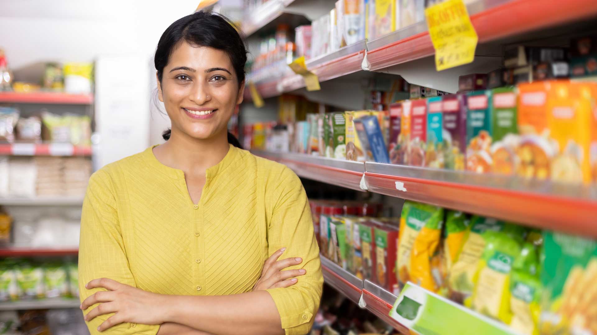 smiling woman inside a convenience store