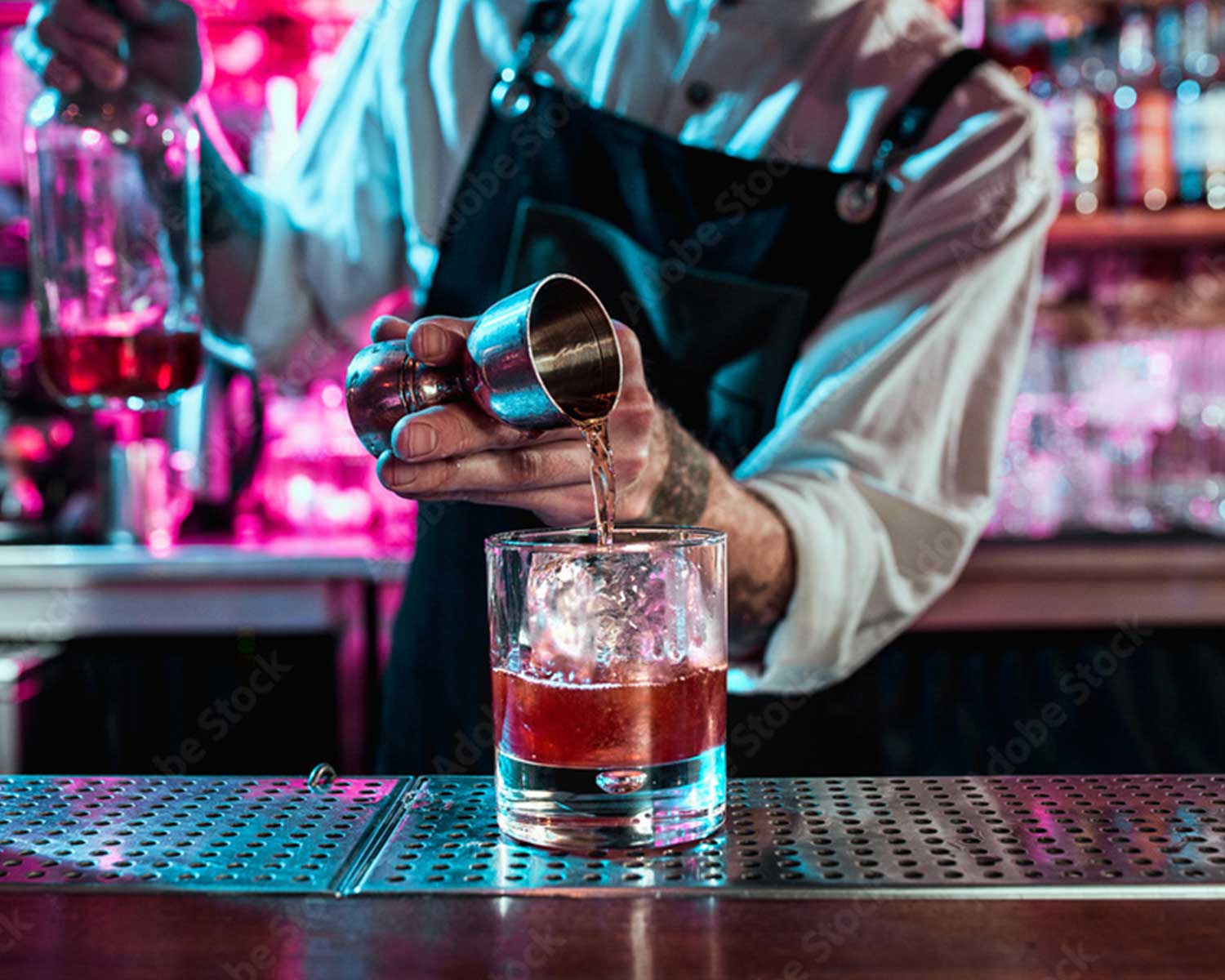 bartender pouring a drink | bar pos
